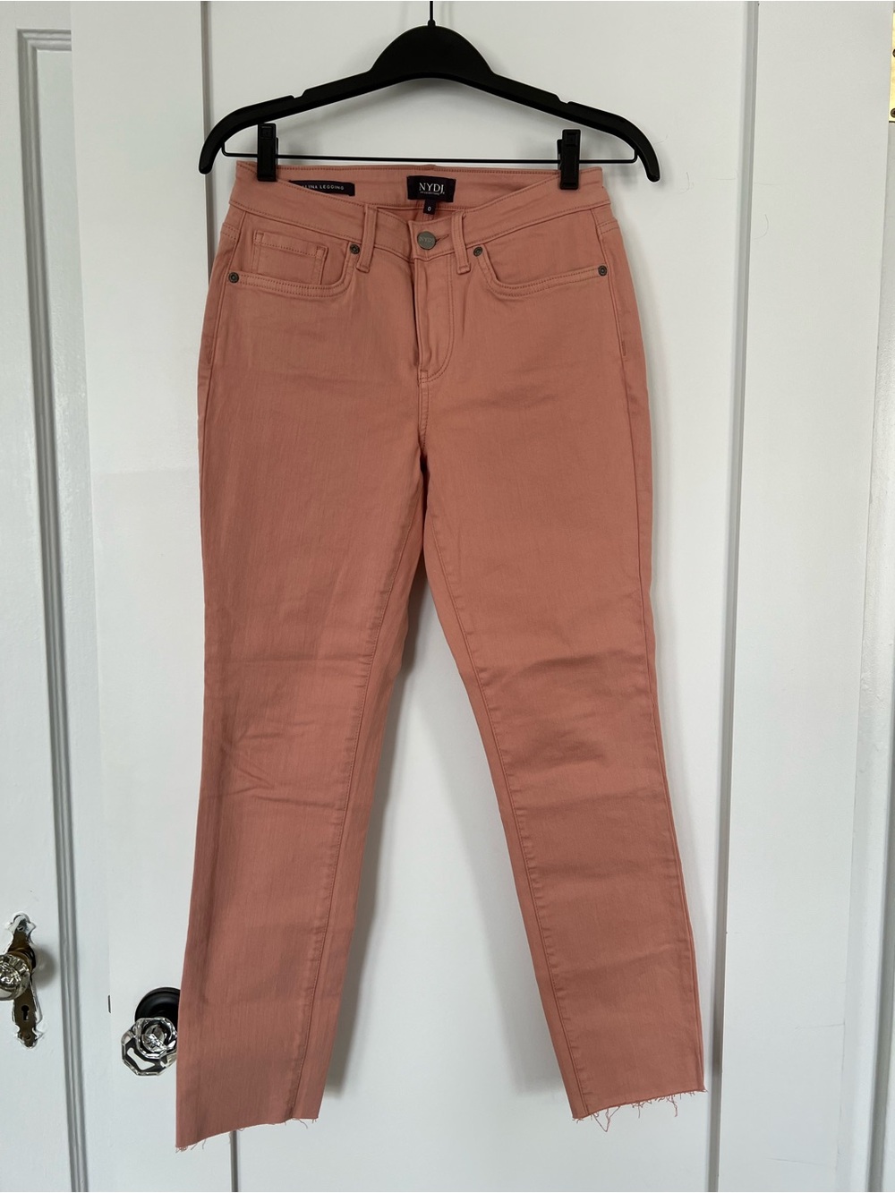 NYDJ straight leg ankle length jeans in peachy pink color. Alina legging style.